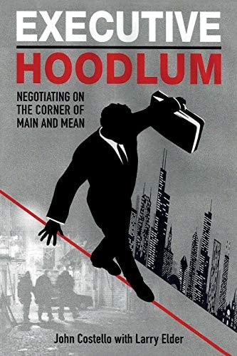 Executive Hoodlum Negotiating on the Corner of Main and Mean