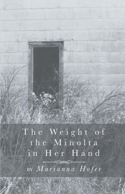 The Weight of the Minolta in Her Hand