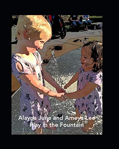 Alayna June and Ameya Lee Play in the Fountain